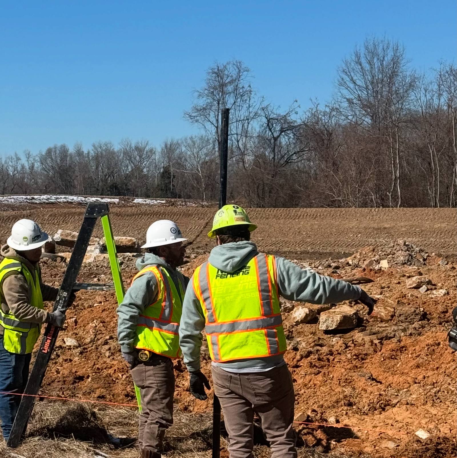 N&P Fencing crew setting fence posts