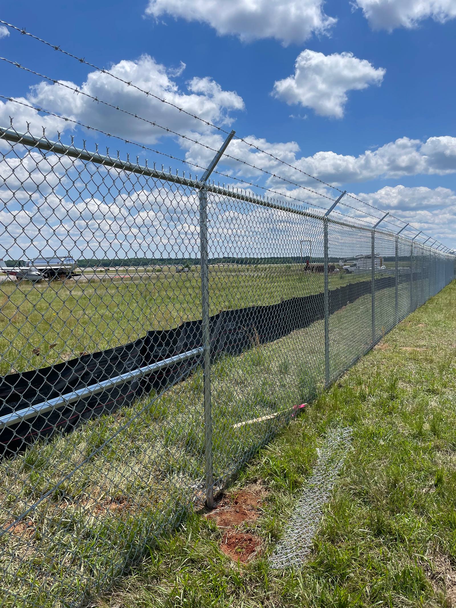 Chain link and barbed wire security fence by N&P Fencing